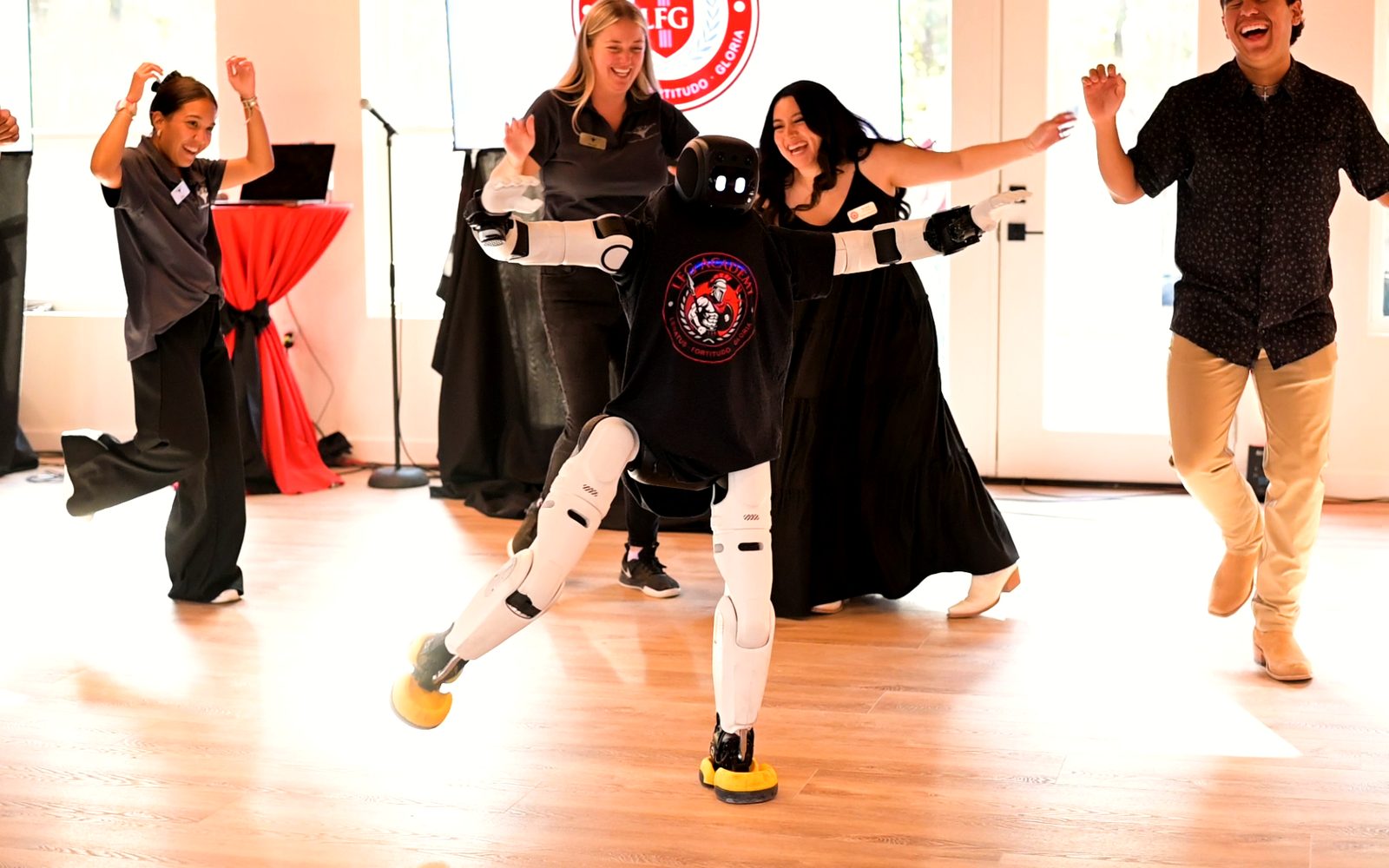 LFG Academy students and staff with the school's robot
